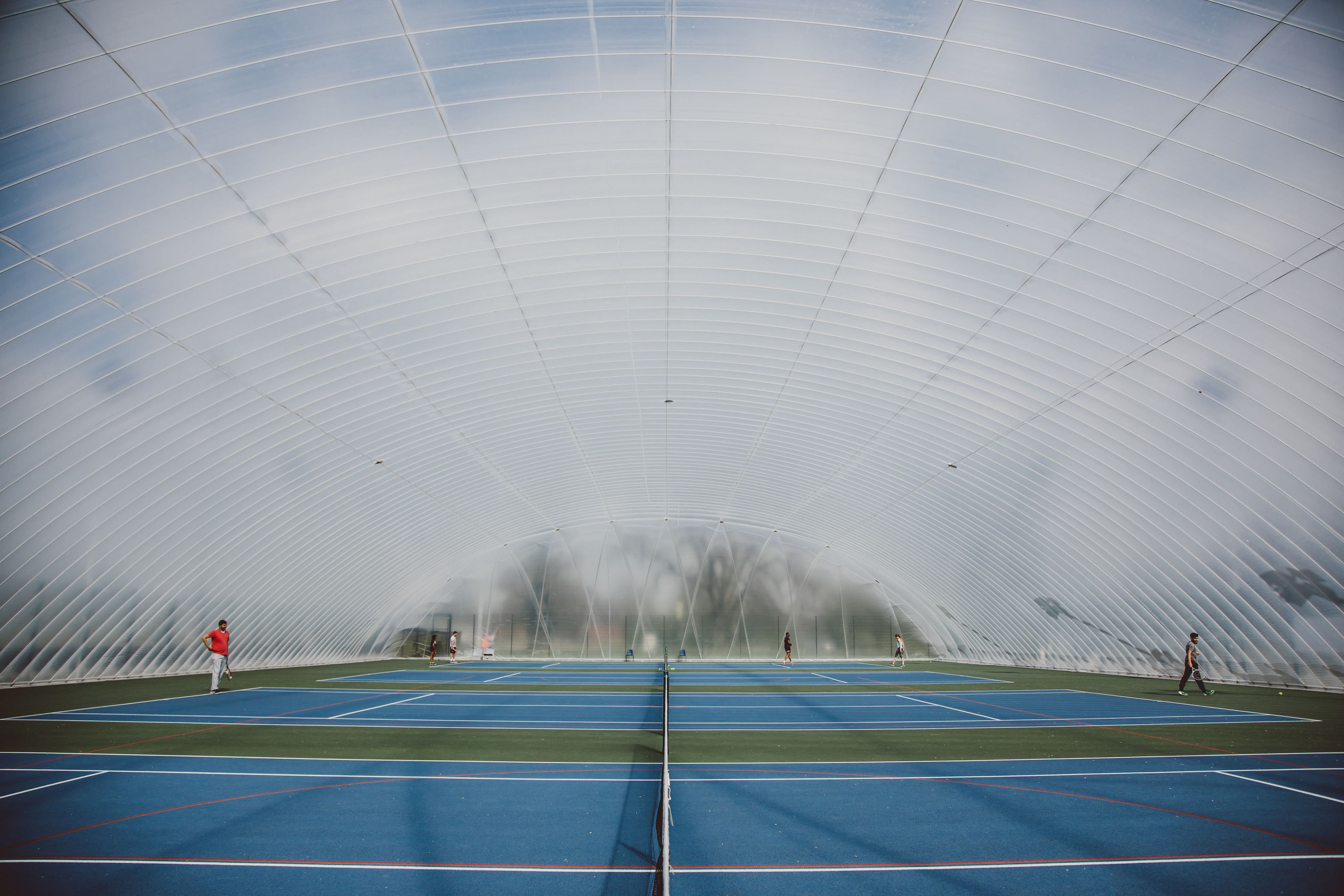 Students playing tennis in the dome