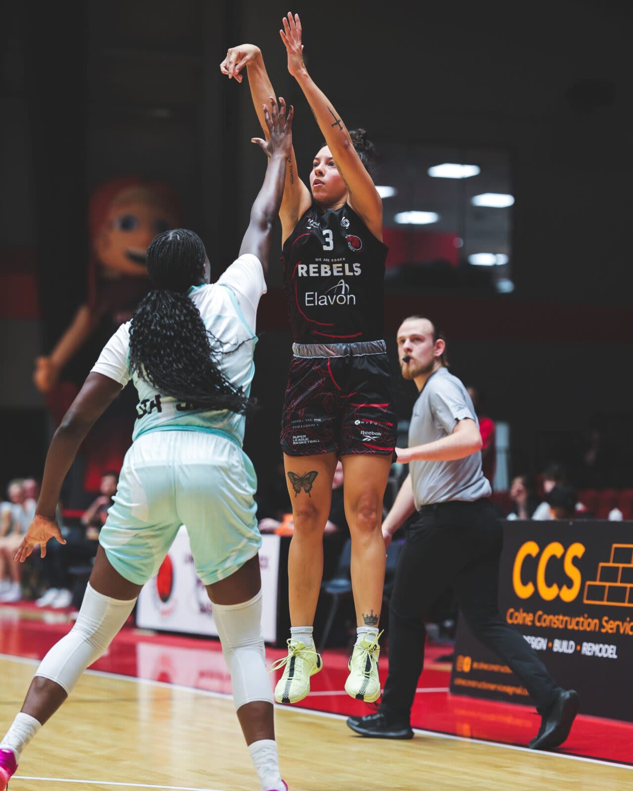 Rebels player throwing a basket ball