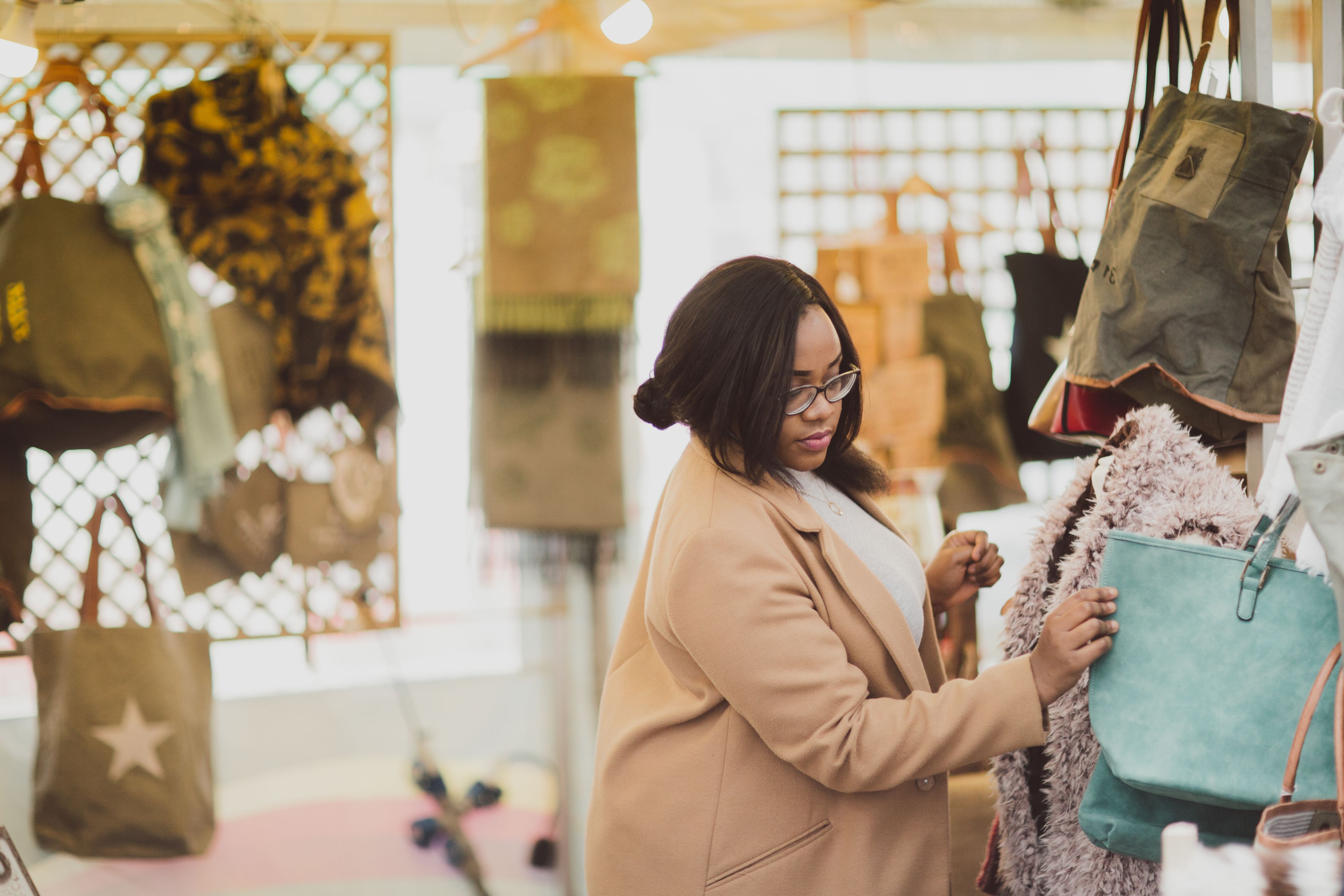 Shopper looking at bags in Colchester city centre