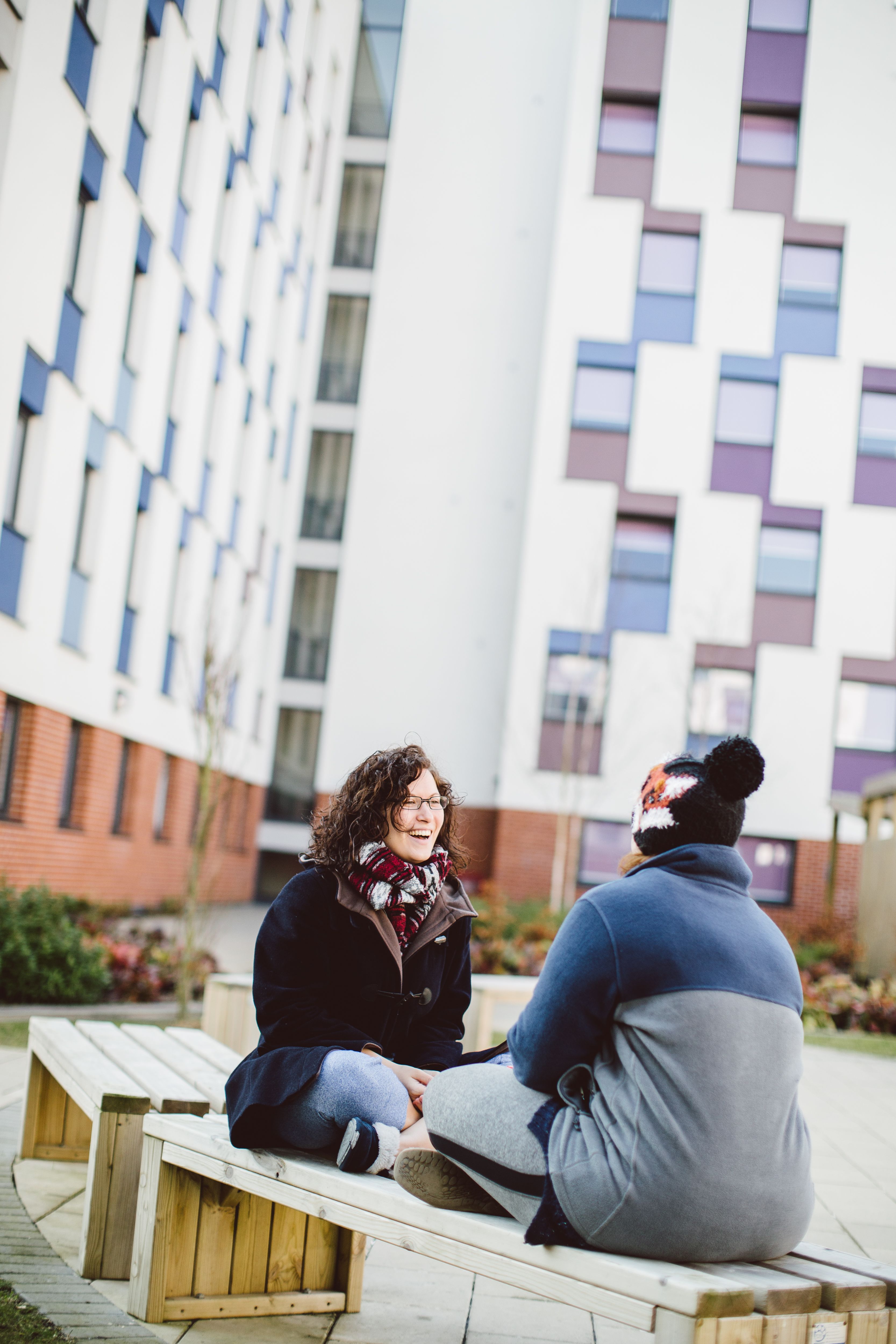 Students sitting outside accommodation