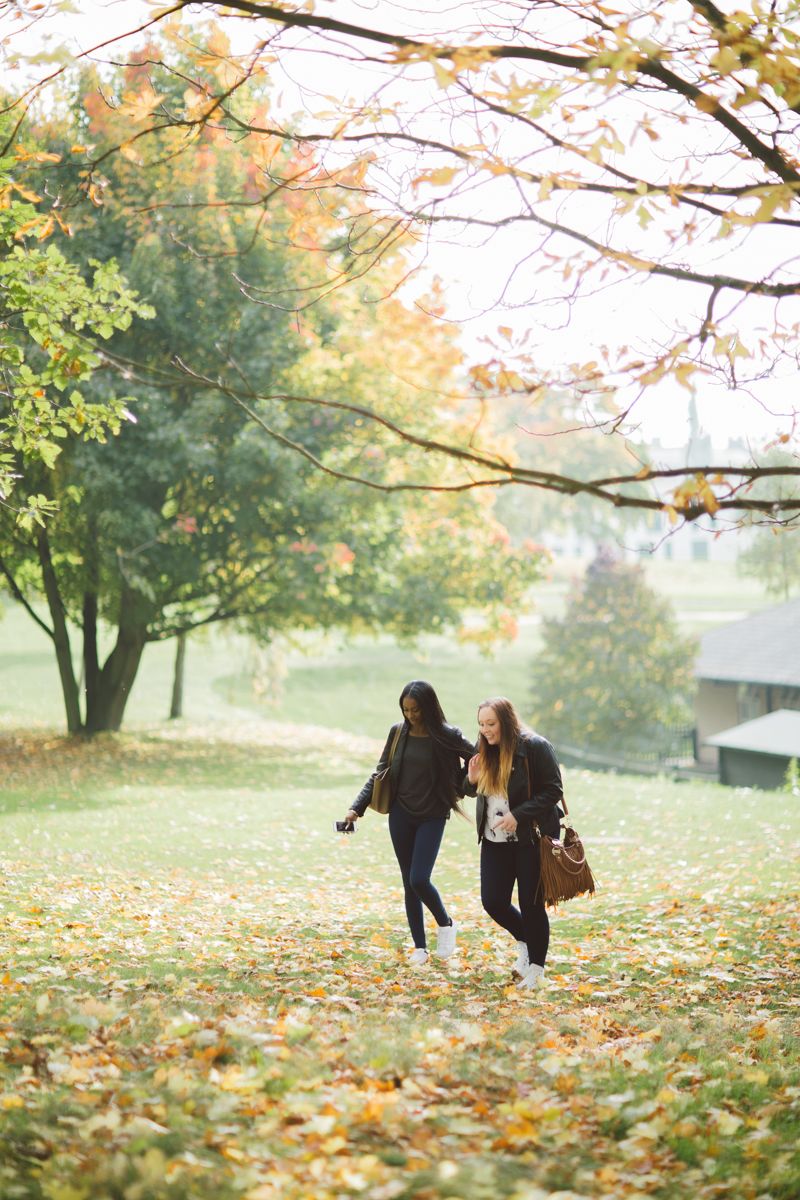 Students walking on the grass on campus