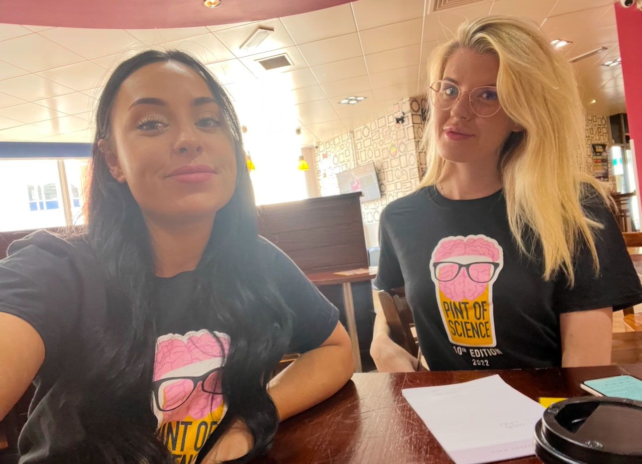 Liv sat with her fellow city coordinator, Ellie. Both are smiling at the camera