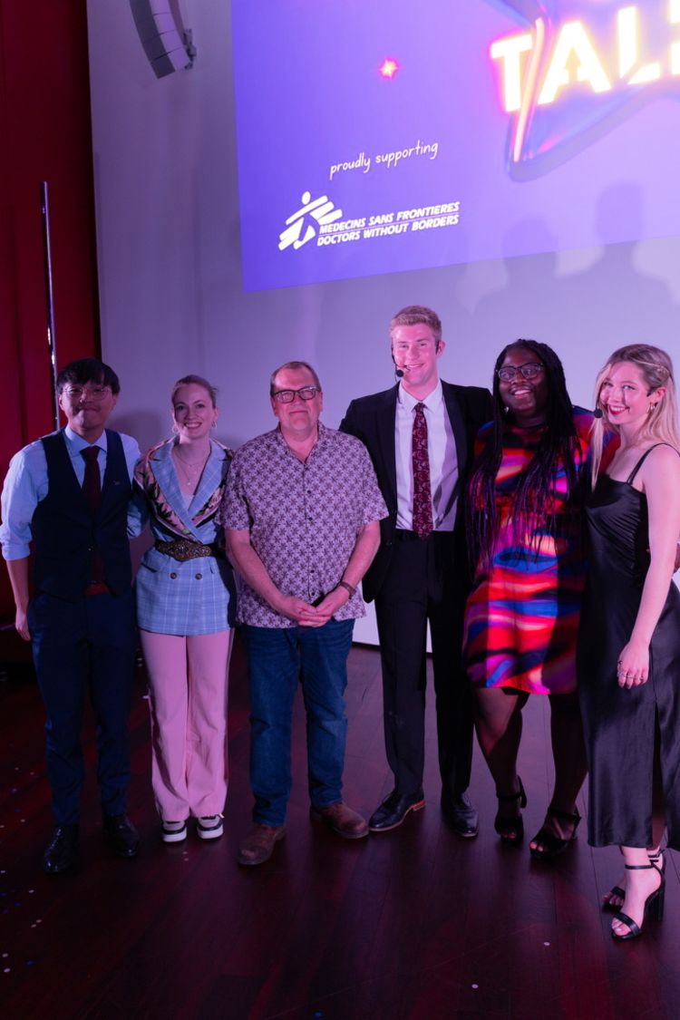 Group of judges at Essex's Got Talent competition, stood in front of the screen