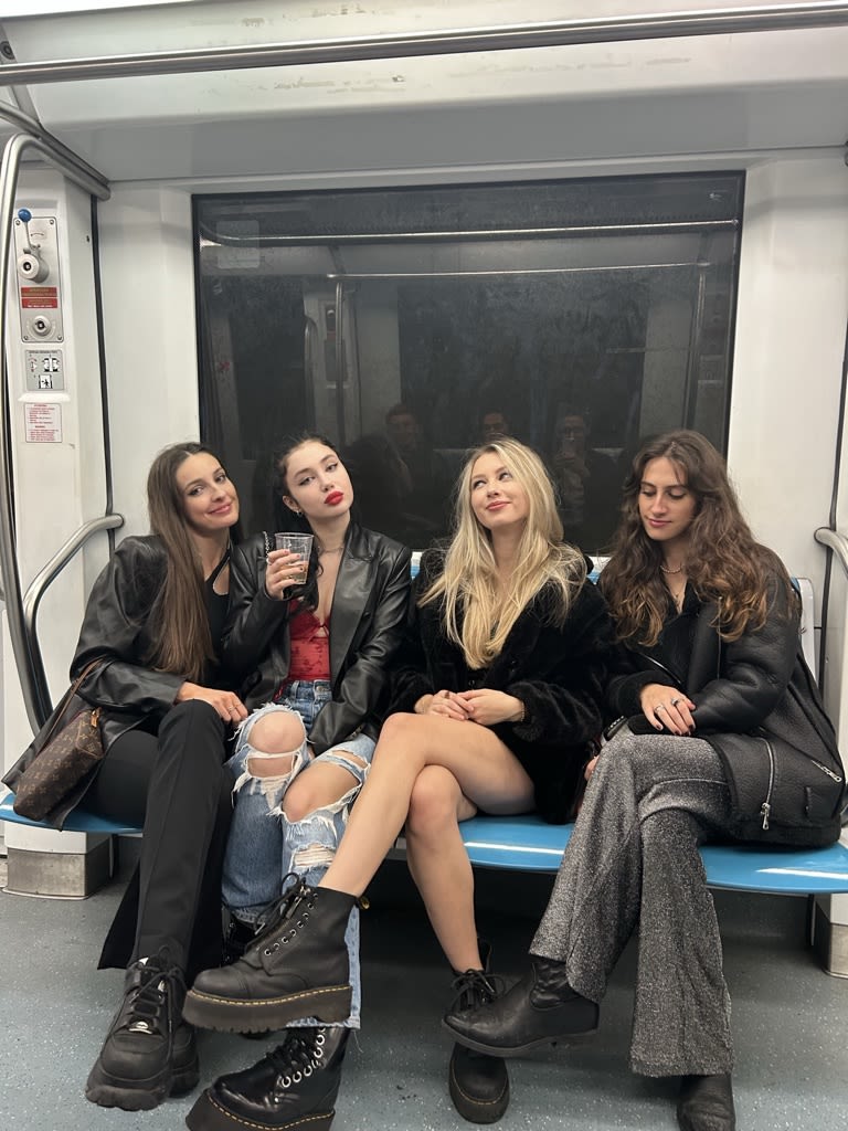 Group of female friends sat on the metro