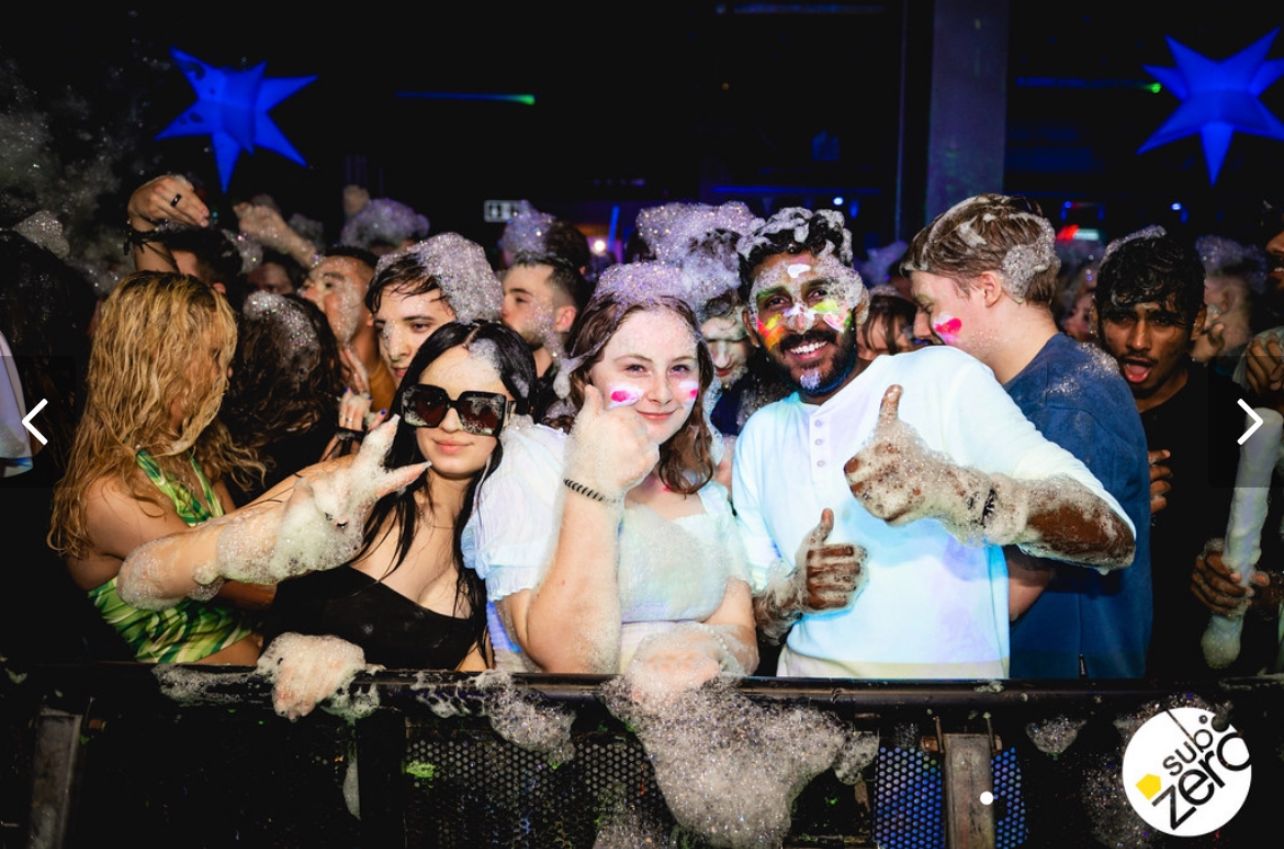Maddie with friends on a night out. They are in sub zero nightclub covered in bubbles from the foam party.