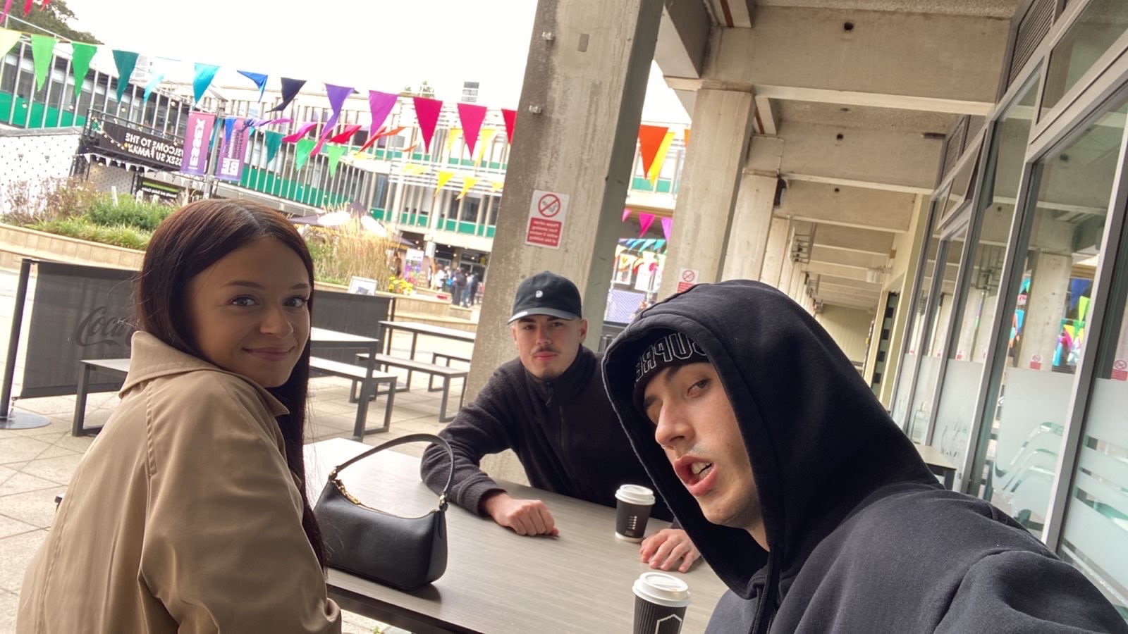 Maddie and 2 friends sat in the squares at Colchester Campus