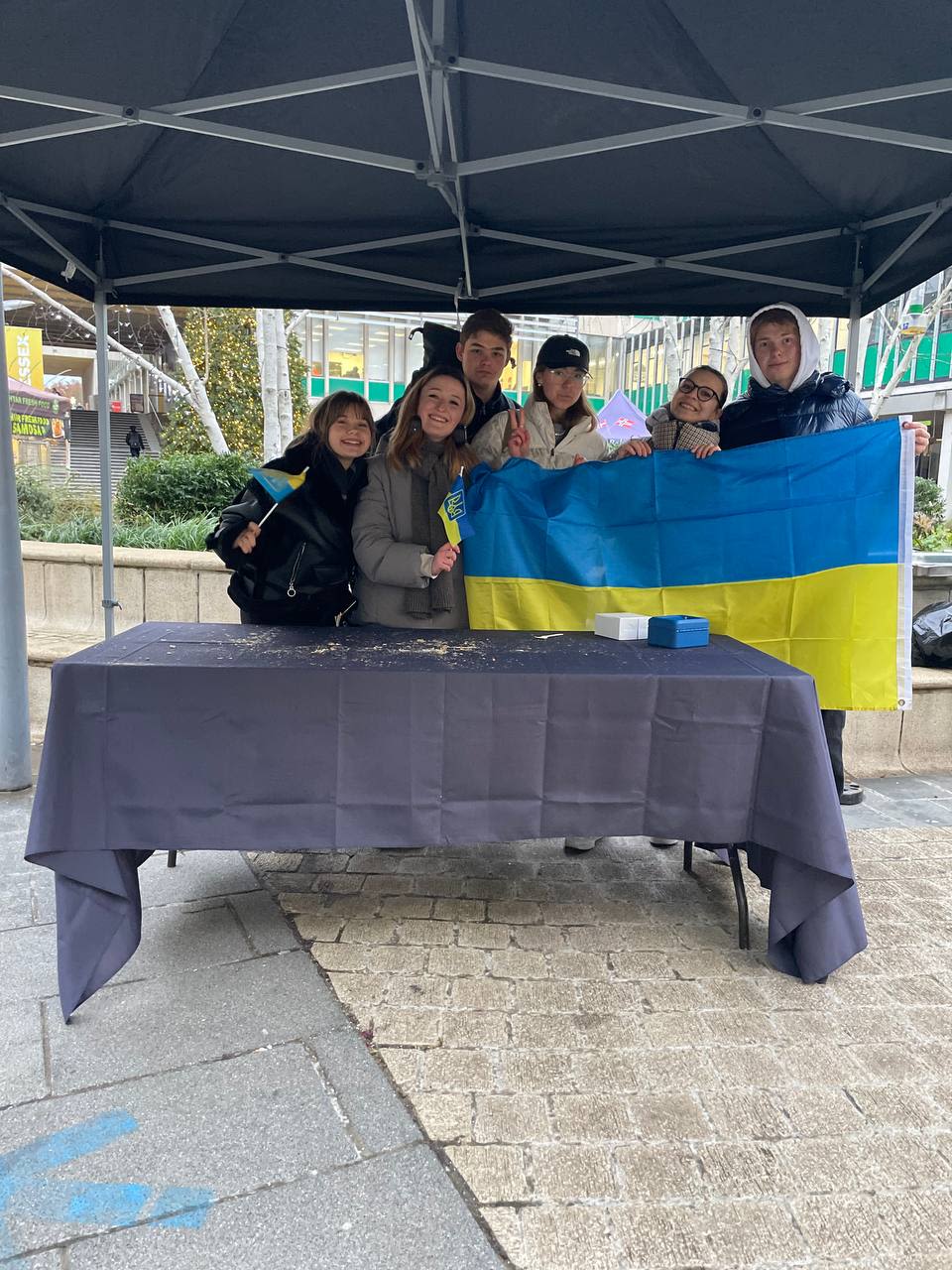 Group of students holding a Ukrainian flag