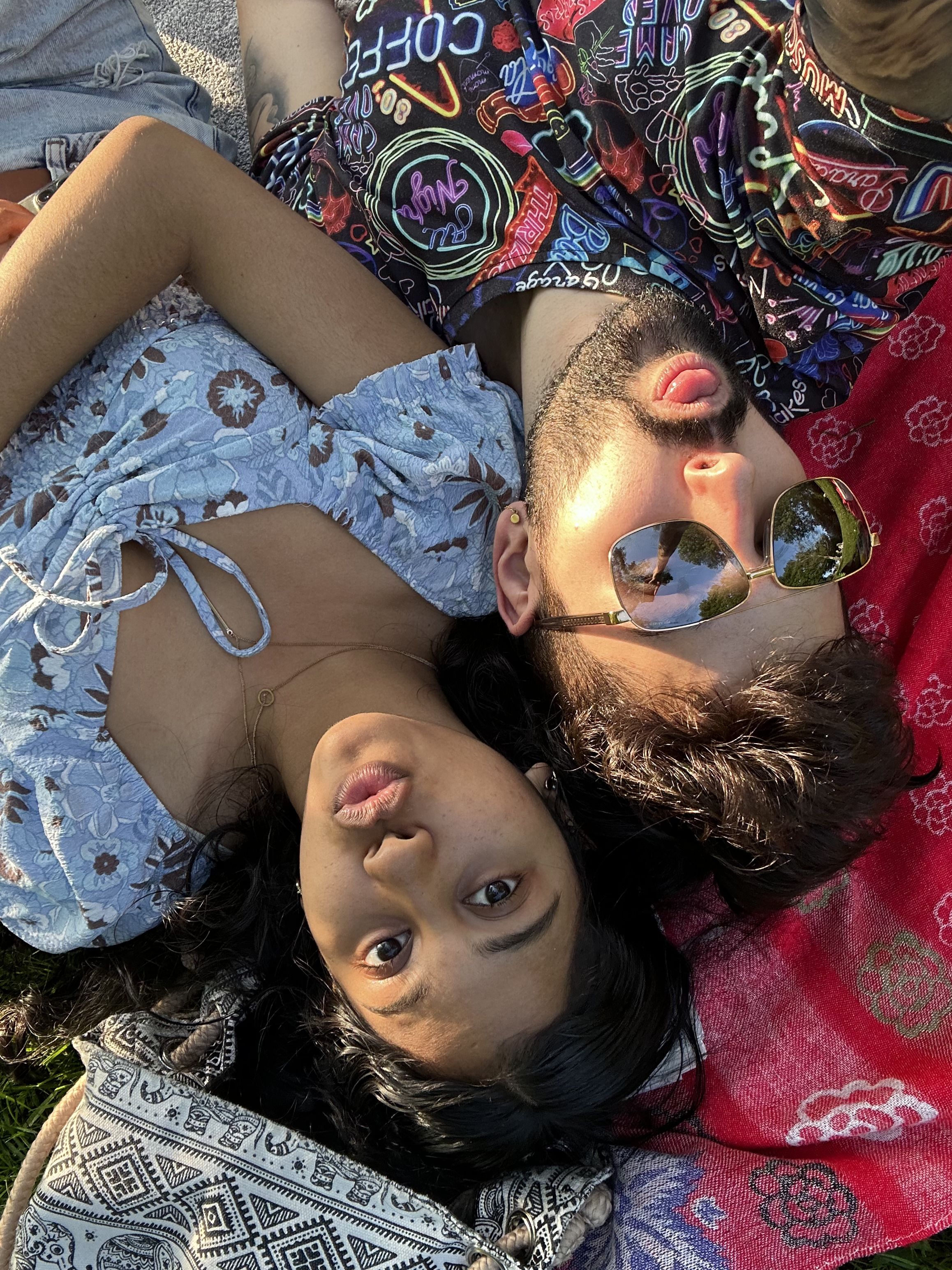Michael with female student, upside down with the sun across their faces