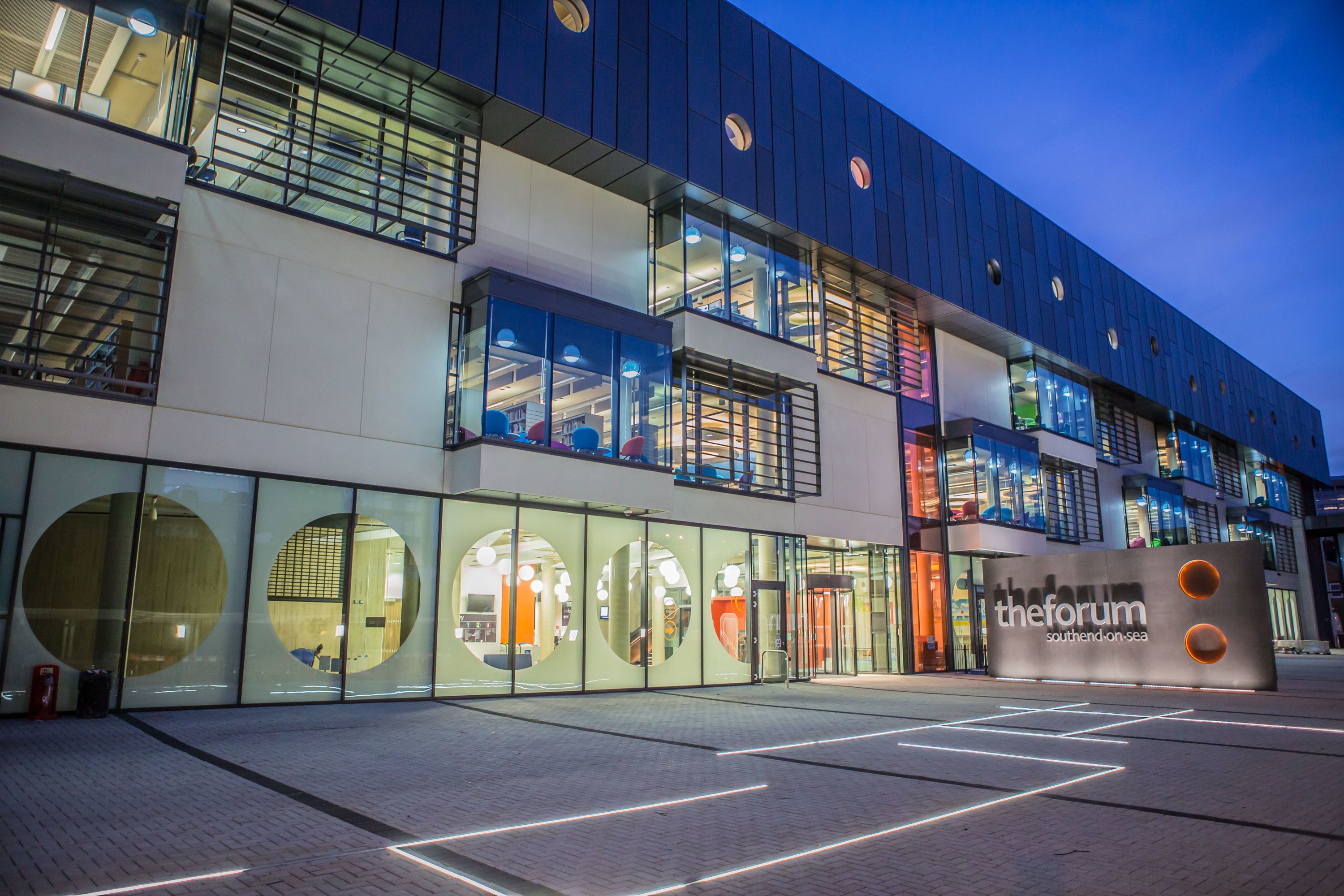 The Forum building at night