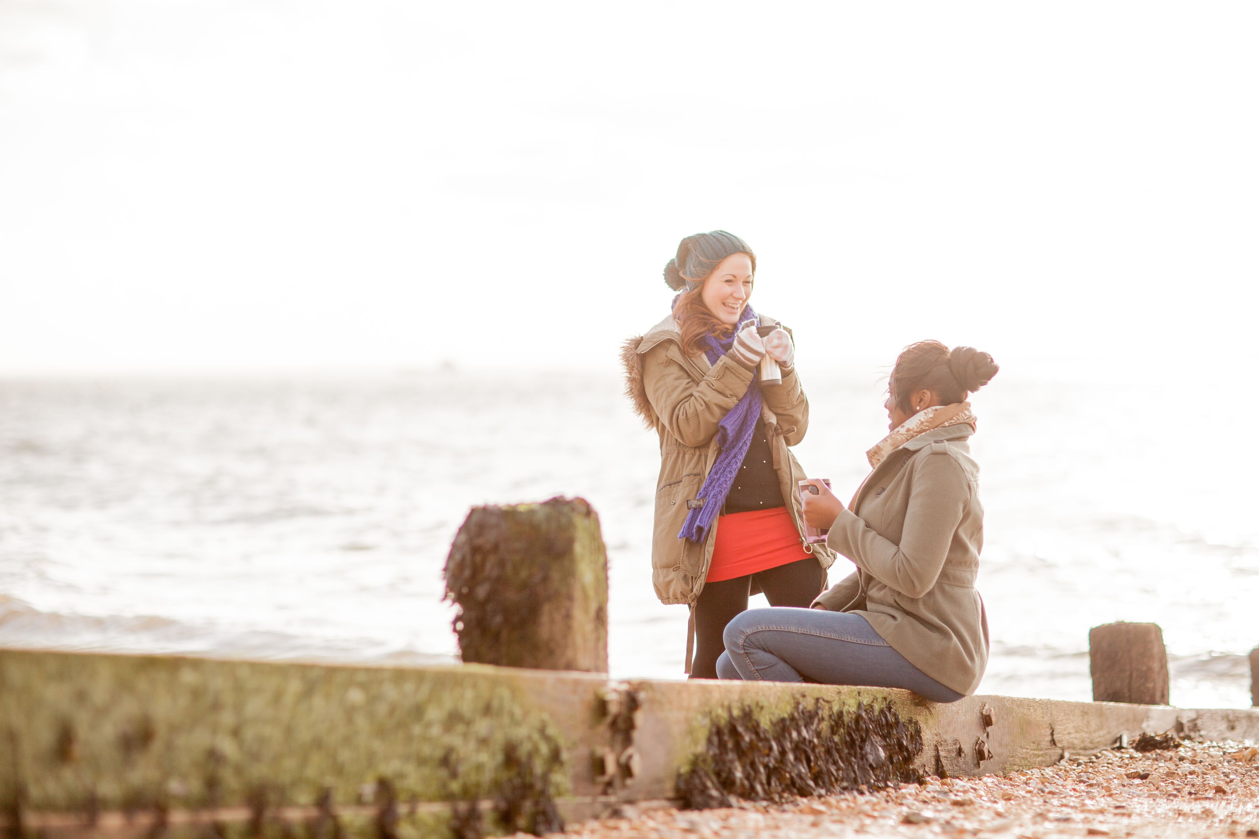 Students with a coffee at the beach